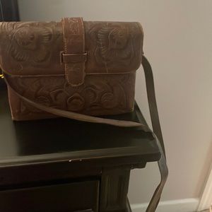 Vintage Flores’ tooled leather crossbody.